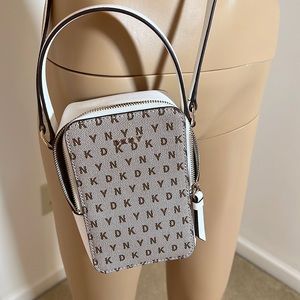 DKNY CROSS BODY PURSE. USED ONLY ONCE